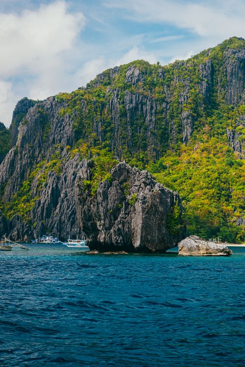 Free Breathtaking view of limestone cliffs and blue waters in El Nido, Philippines. Stock Photo