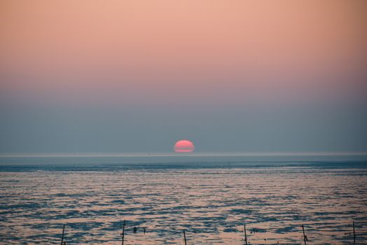 Stunning ocean sunset with vivid colors and serene horizon view.