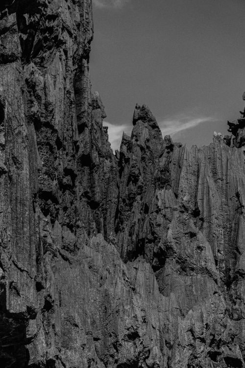 Free A striking black and white photograph of dramatic rocky cliffs with detailed textures. Stock Photo