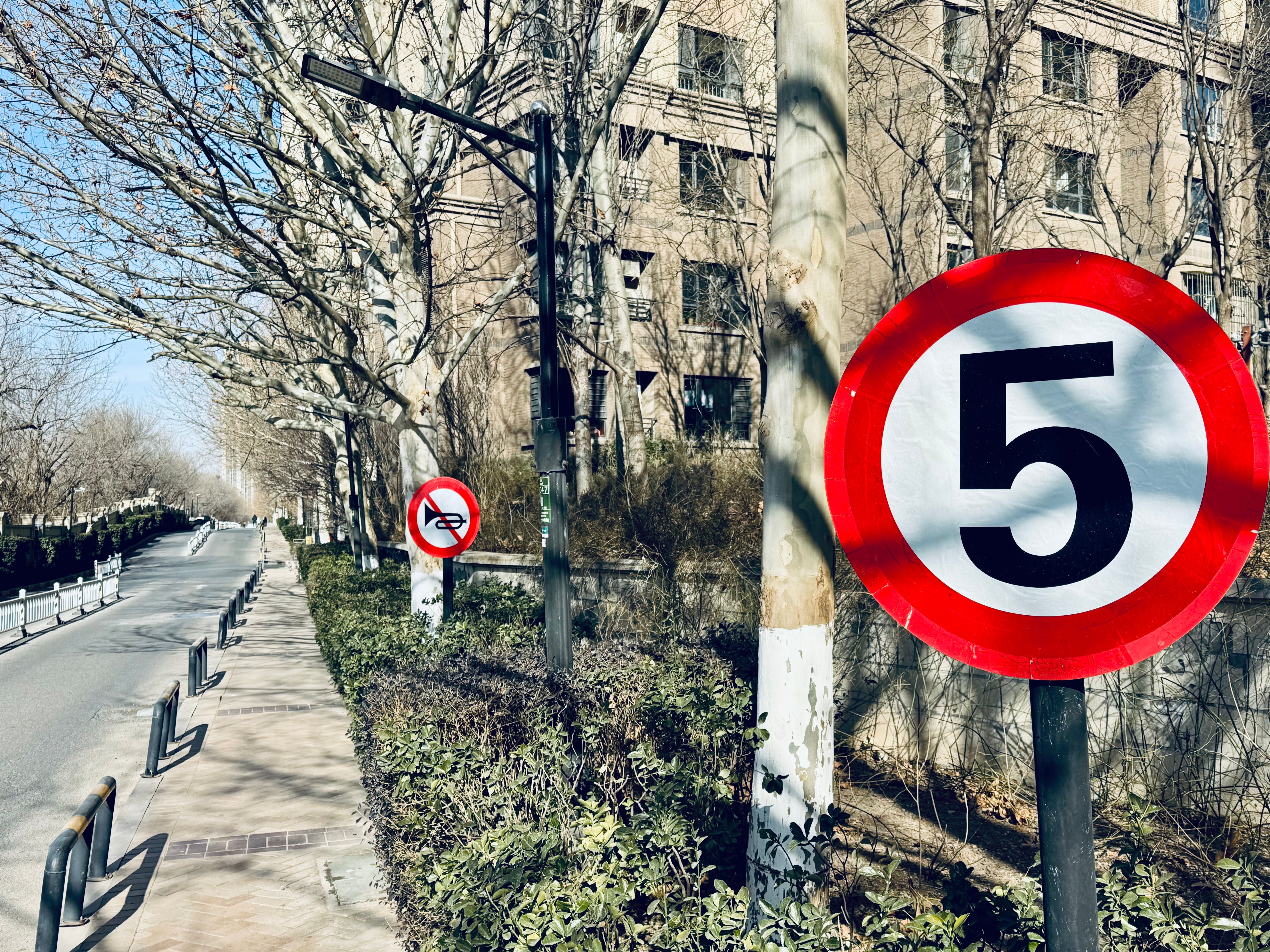 Urban street with speed limit and no motorcycles signs
