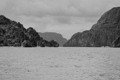 Free Black and white photo of stunning limestone cliffs and calm sea, Palawan, Philippines. Stock Photo