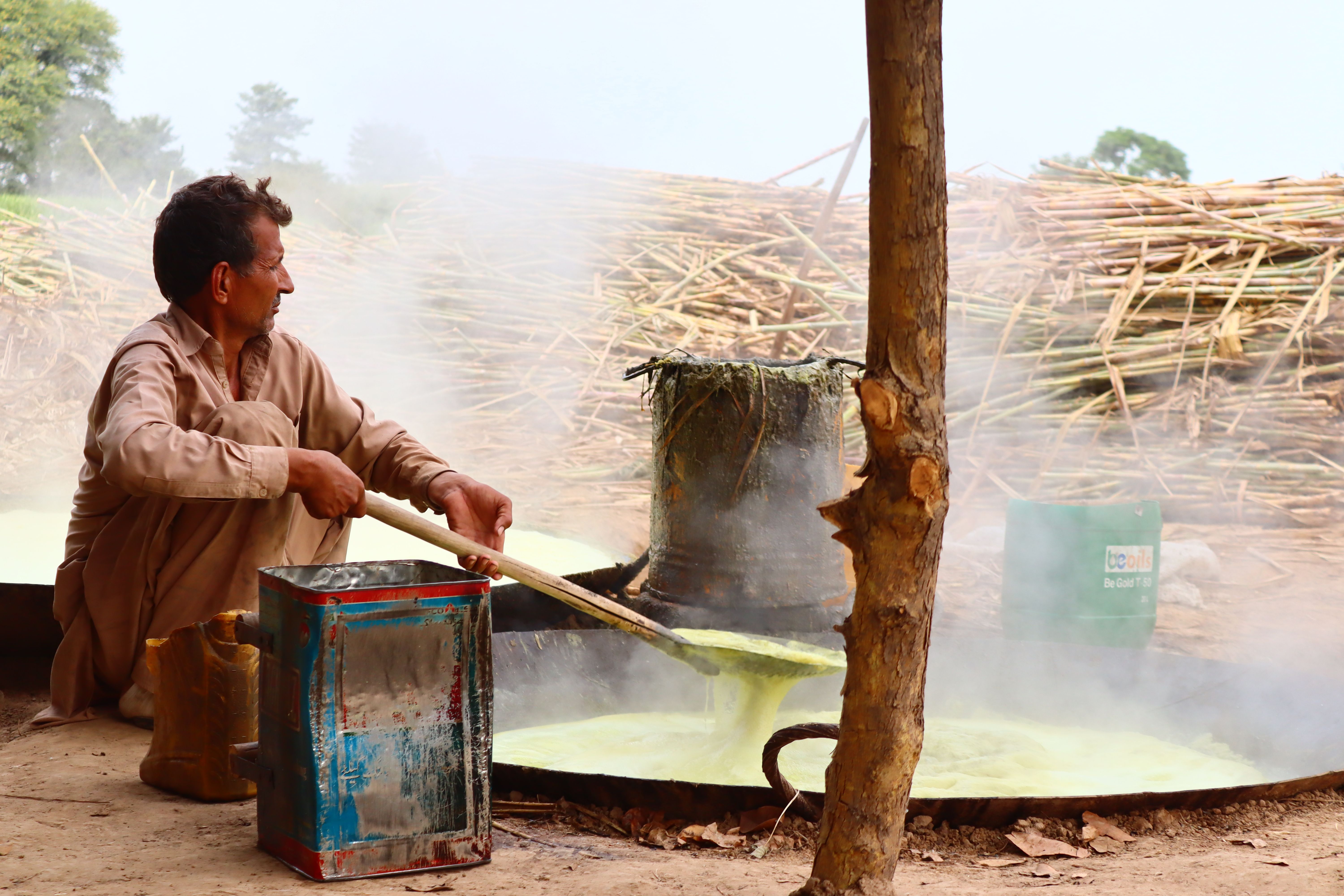 Traditional Sugarcane Juice Boiling Process Outdoors · Free Stock Photo