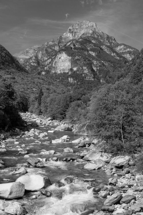 Free Black and white view of Verzasca River and valley with lush foliage in Ticino, Switzerland. Stock Photo
