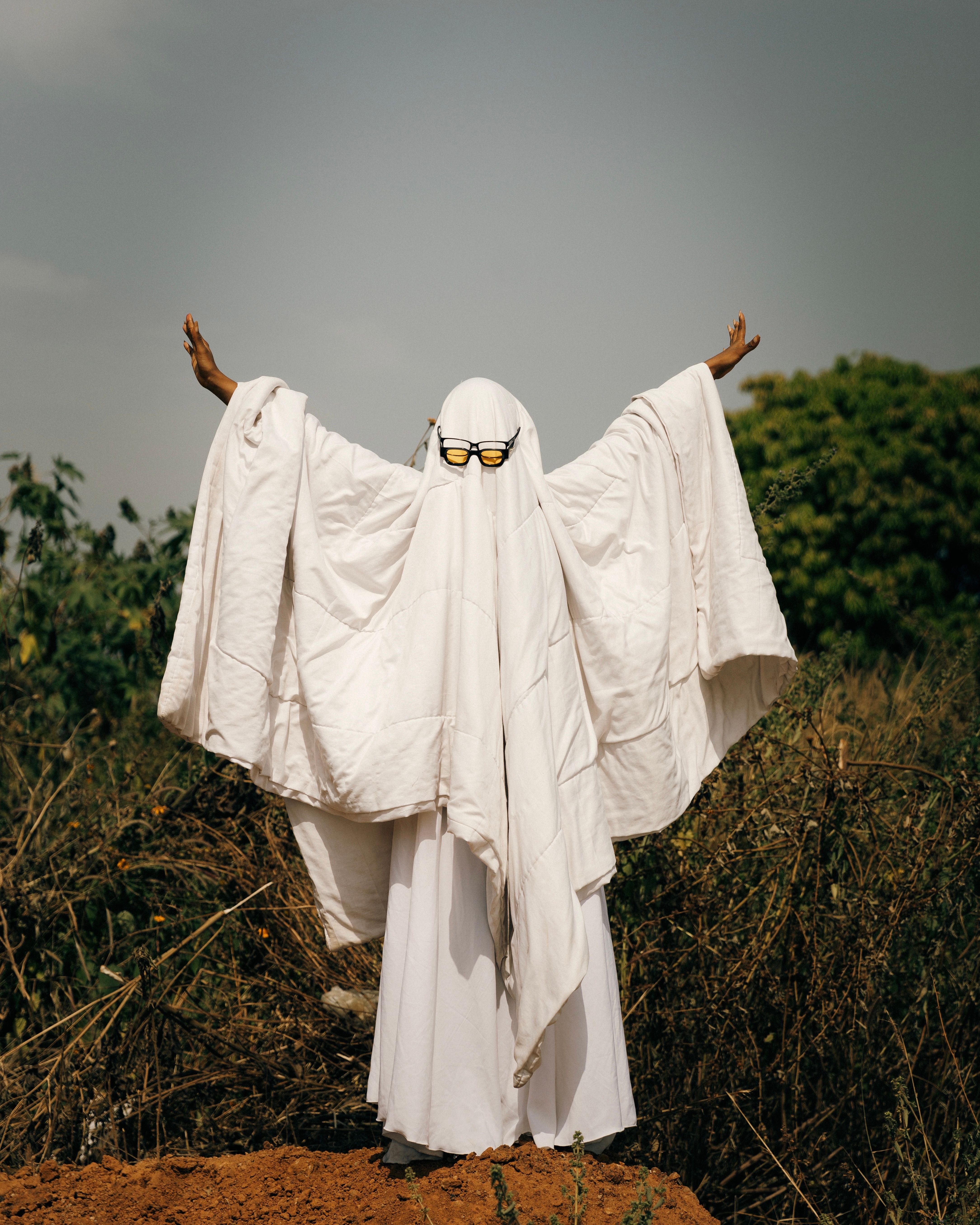 Mystical Figure in White Robe Outdoors · Free Stock Photo