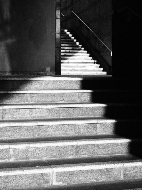 Free Black and white staircase with dramatic lighting and shadows in Hong Kong, showcasing urban architecture. Stock Photo