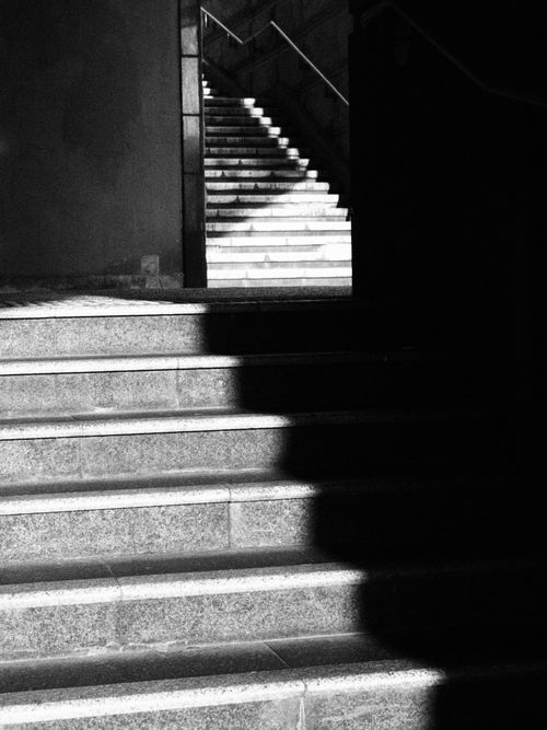 Free Black and white stairs with dramatic shadows in Hong Kong. Captivating urban geometry. Stock Photo