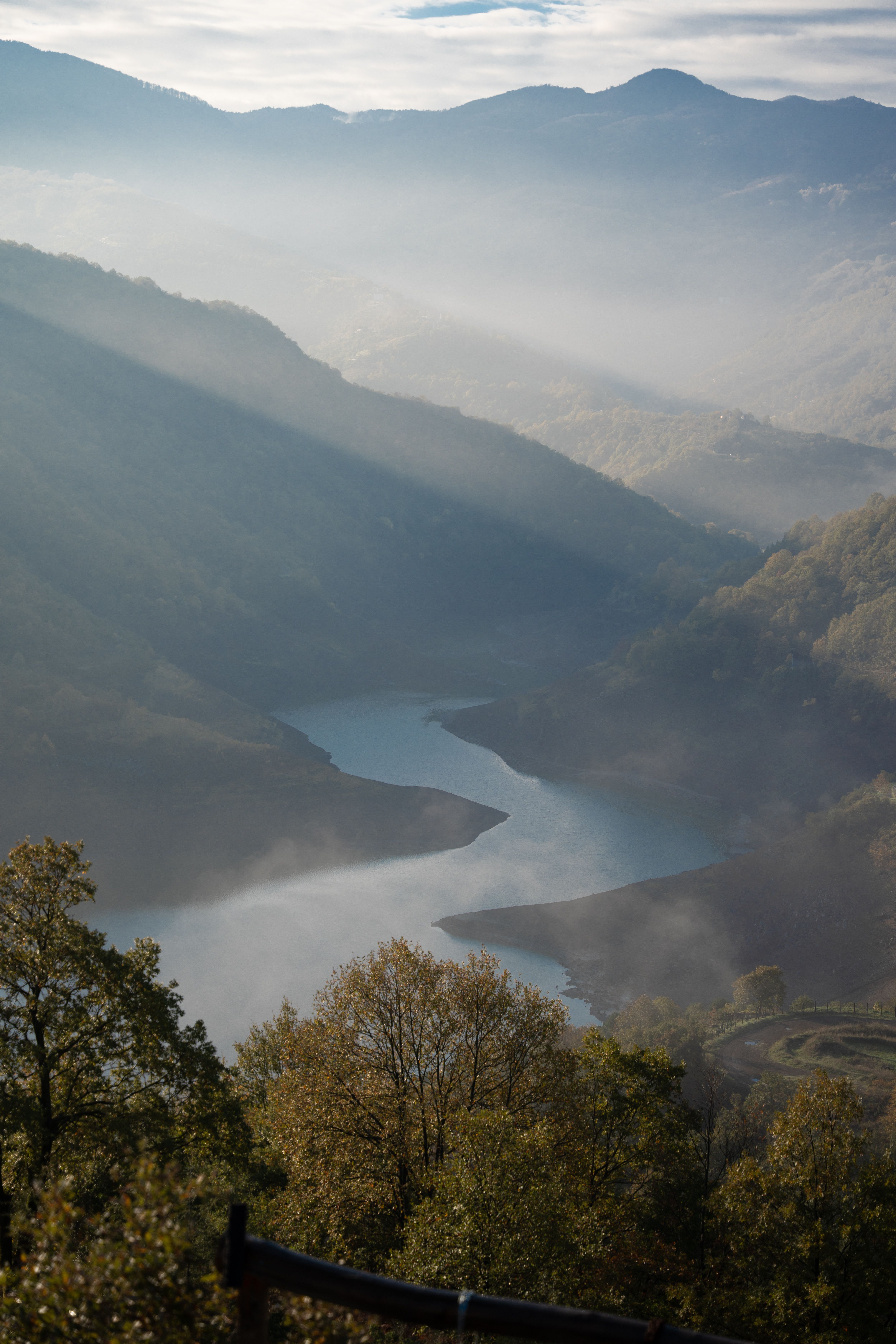 Serene Mountain Valley with Misty River View · Free Stock Photo