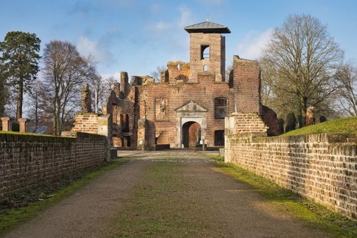 Free Explore the ruins of an old brick castle, a historic landmark surrounded by winter foliage. Stock Photo