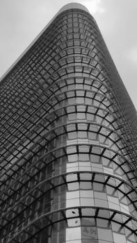 Black and white photo of a modern building in Kuala Lumpur showcasing unique design.