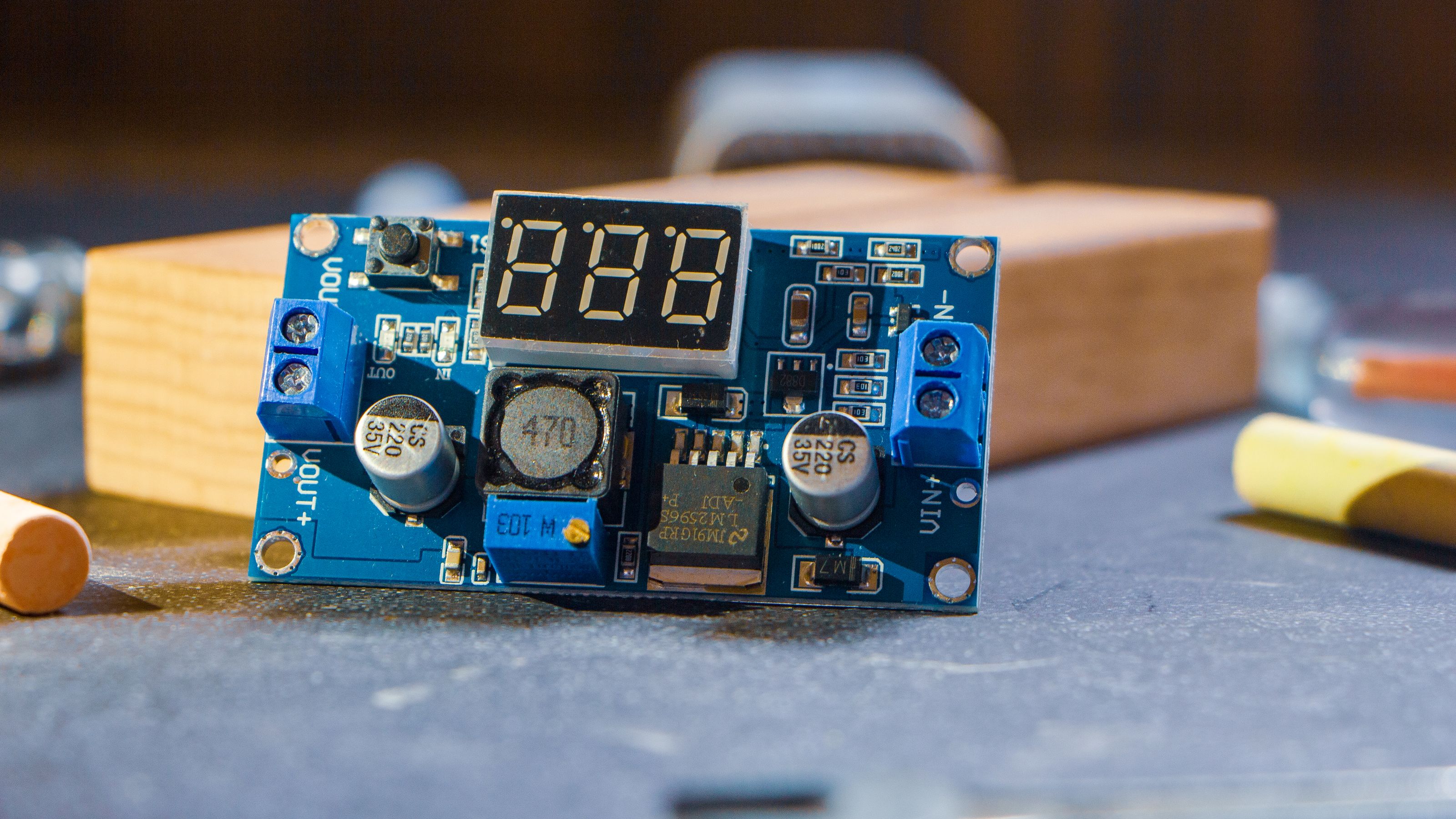 Populated electronic circuit board on a workshop bench