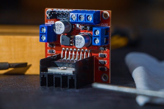 Detailed view of a robotics component with capacitors and connections, captured in Dhaka, Bangladesh.