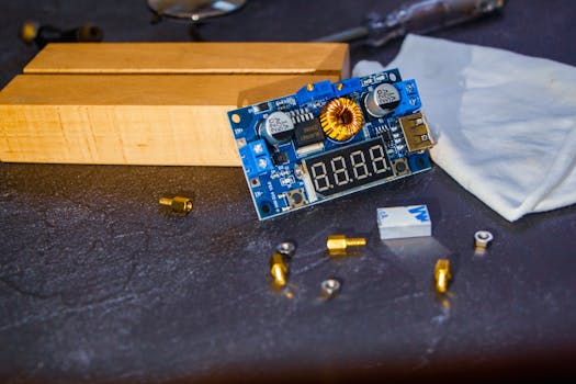 Detailed view of a circuit board and electronic components on a table.