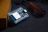 Microcontroller and Tools on Dark Surface