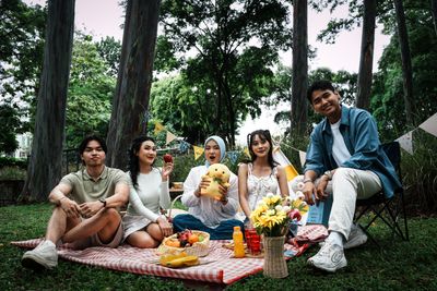 Friends sharing a picnic in the park — photo by N Sopyan on Pexels