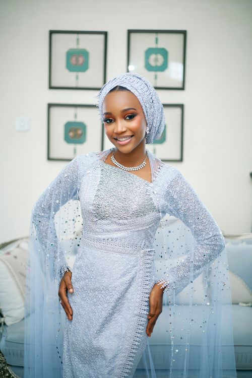 Free Smiling woman in intricately beaded traditional attire indoors, showcasing cultural fashion. Stock Photo