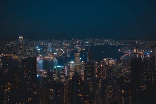 Free Breathtaking night cityscape of Hong Kong Island's vibrant skyline overlooking the harbor. Stock Photo