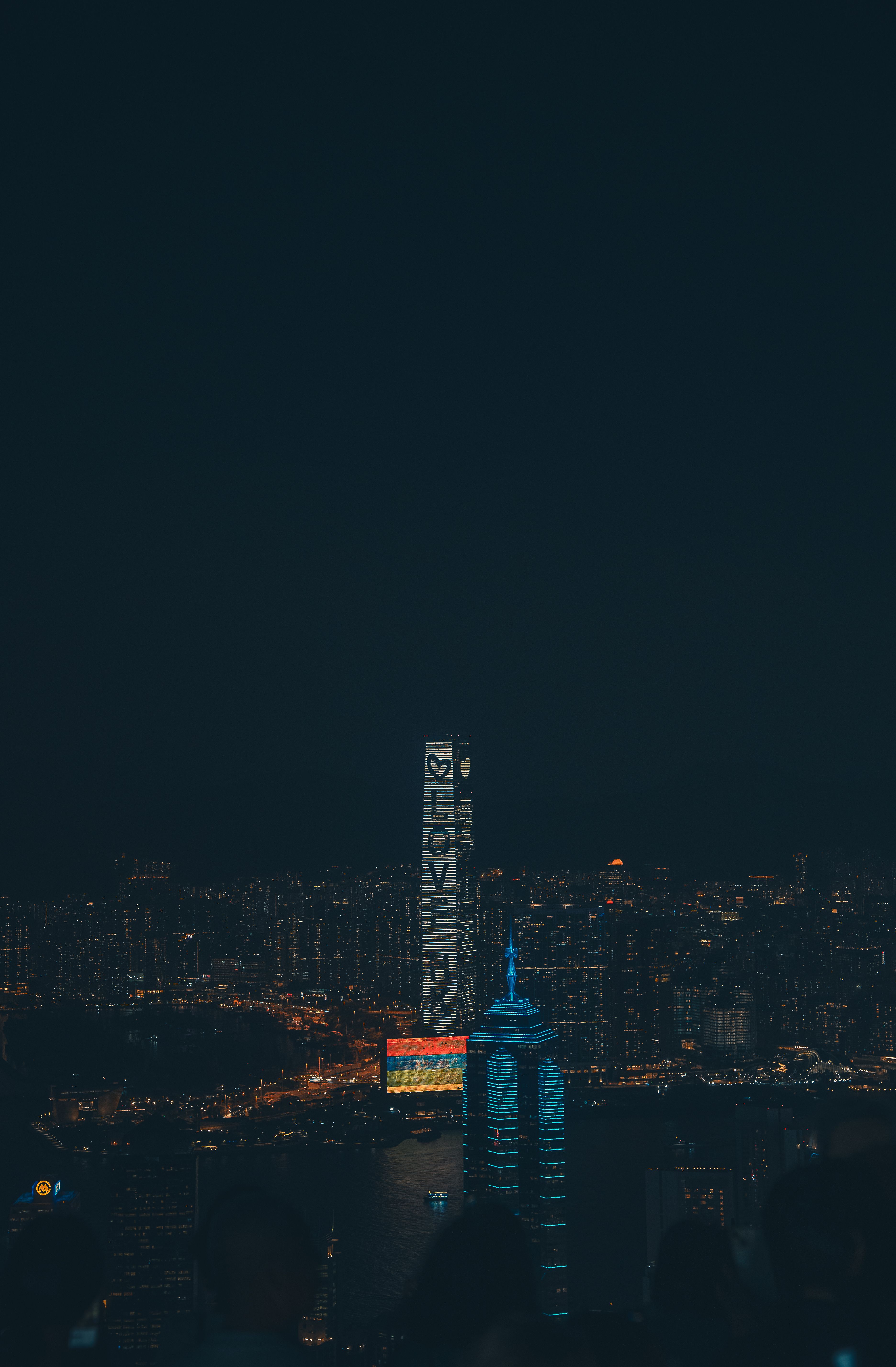 Stunning Hong Kong skyline with 'Love HK' building lights up the night. Perfect for city lovers.