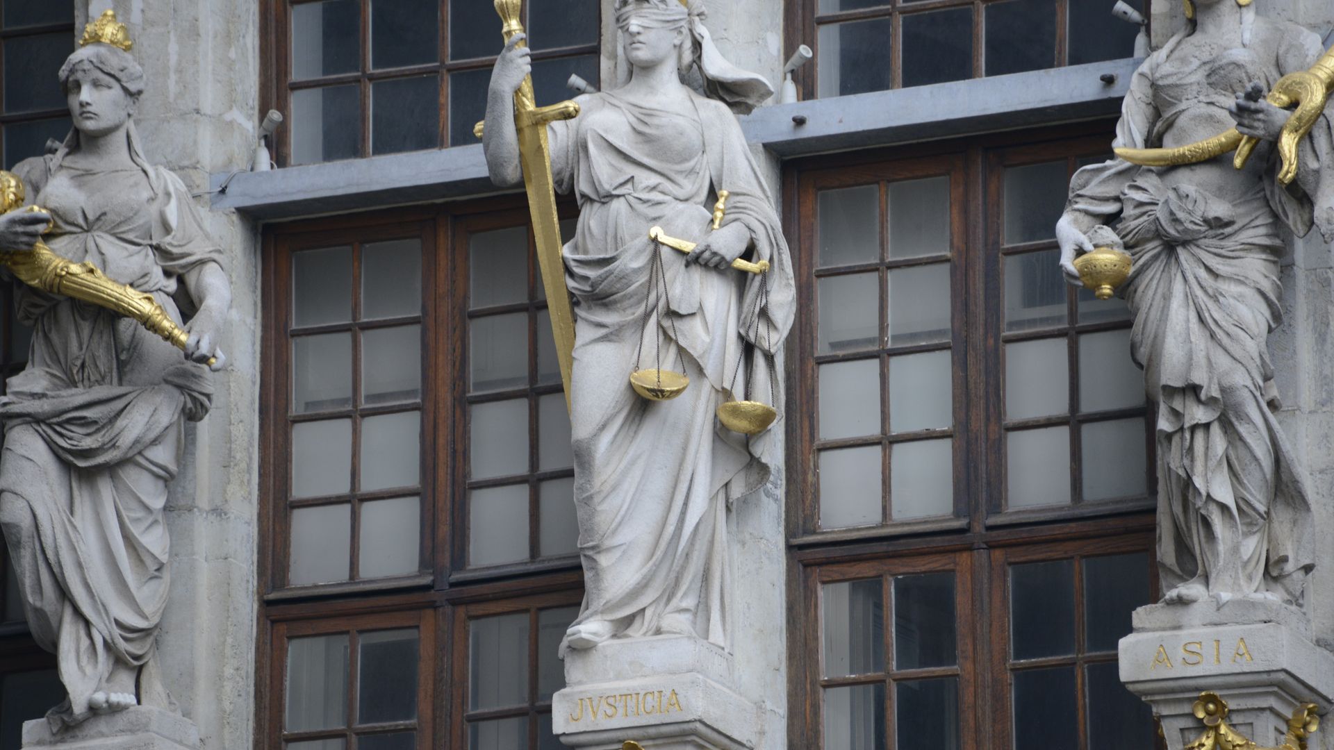 modafinil legal status UK: What You Need to Know Detailed view of Justicia, Europa, and Asia statues on a historical building facade showcasing justice and continents — modafinil legal status UK