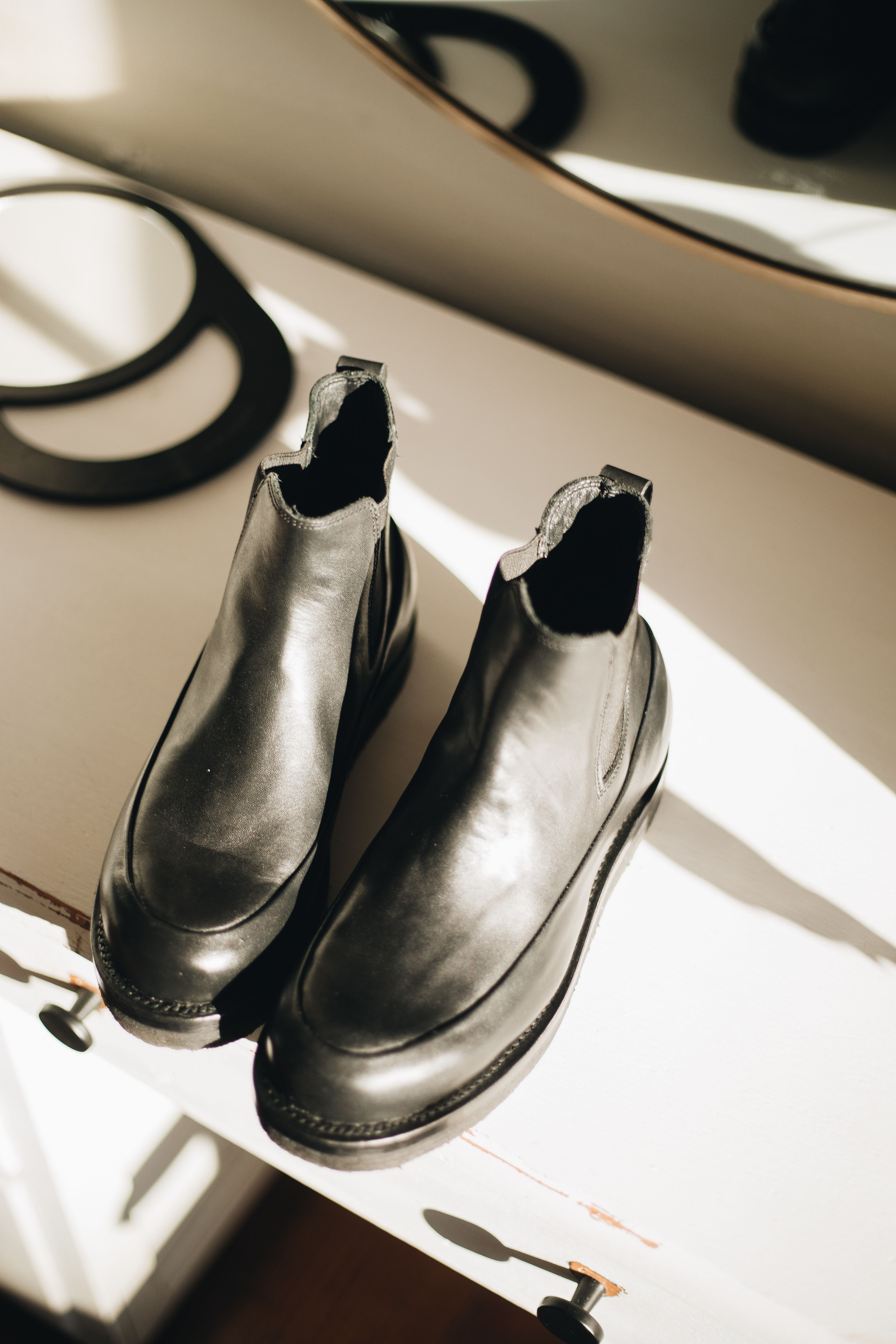 Lyon ankle boot in black on a minimalist display