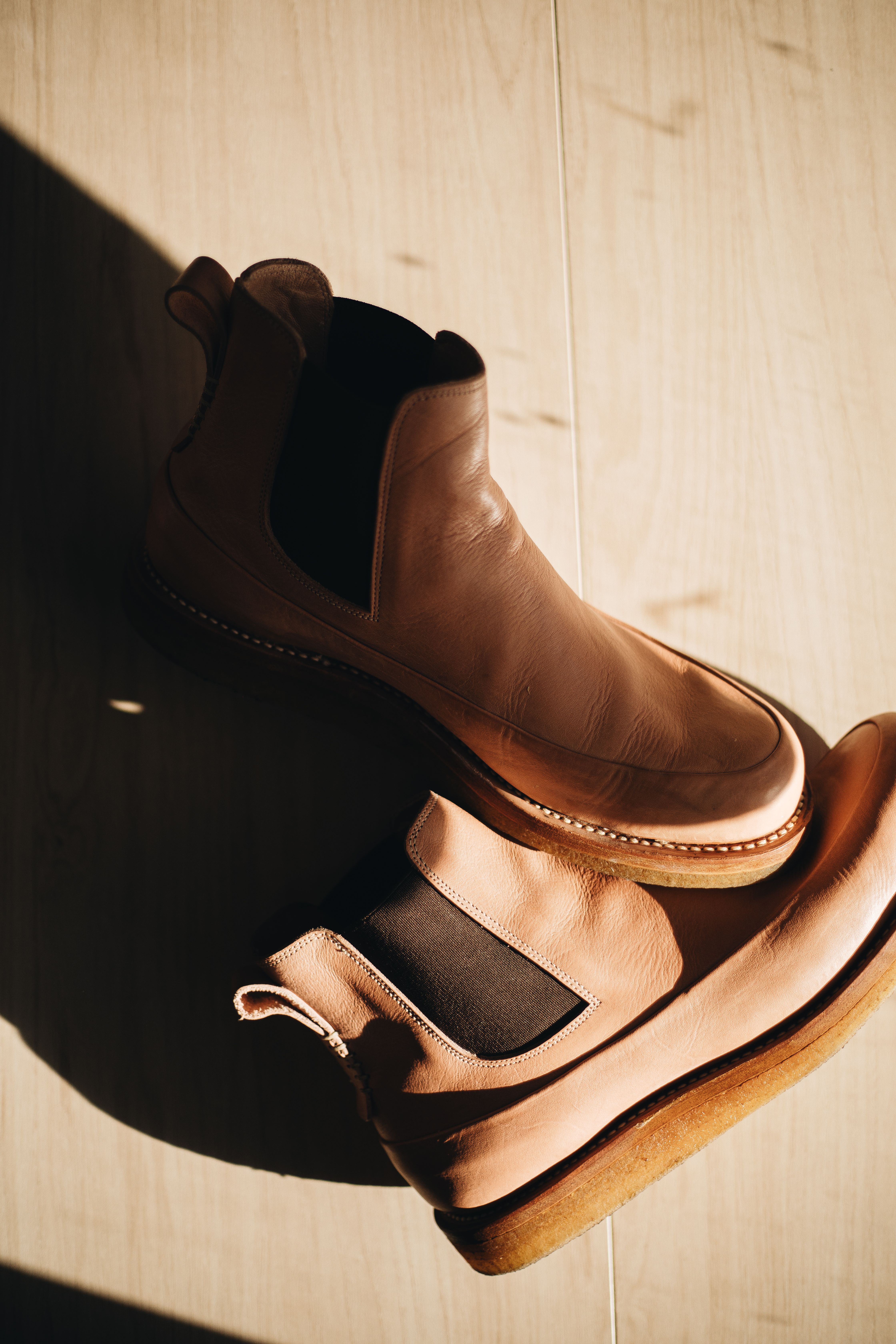Handcrafted leather boots in warm light