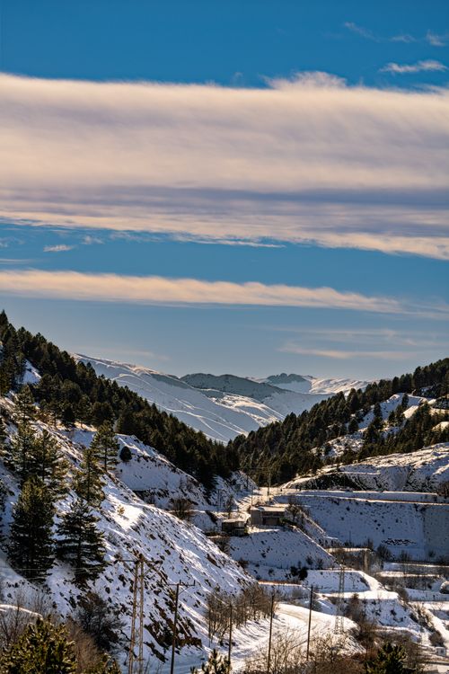 Free Breathtaking winter view of snow-covered mountains and forests in Çelikhan, Türkiye. Stock Photo