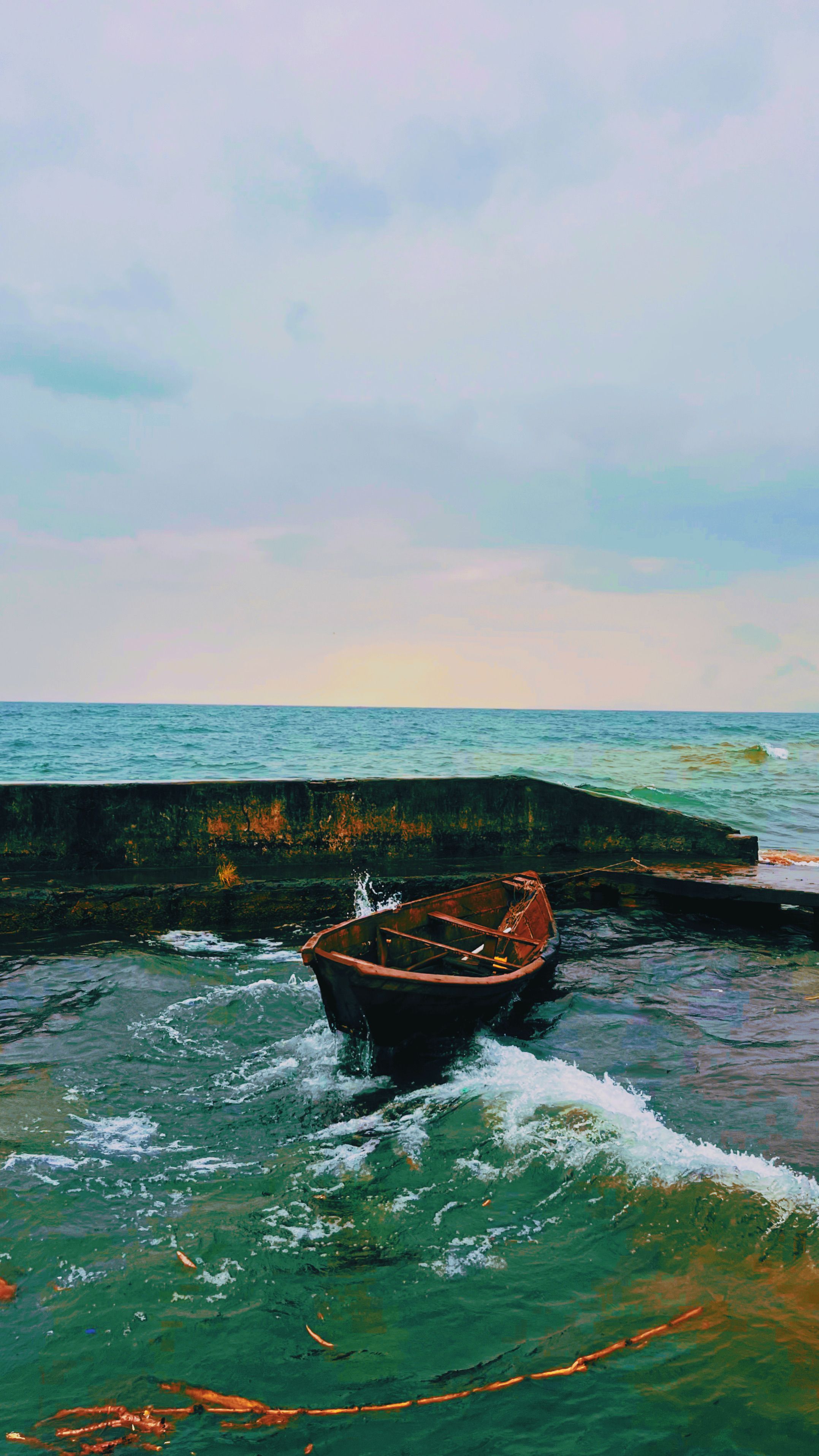 Lonely Wooden Boat in Turbulent Sea Waters