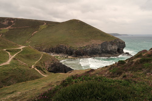 Free Dramatic coastal landscape of St Agnes, Cornwall featuring rugged cliffs and wild sea. Stock Photo