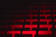 Empty Theater Seats in Dramatic Lighting