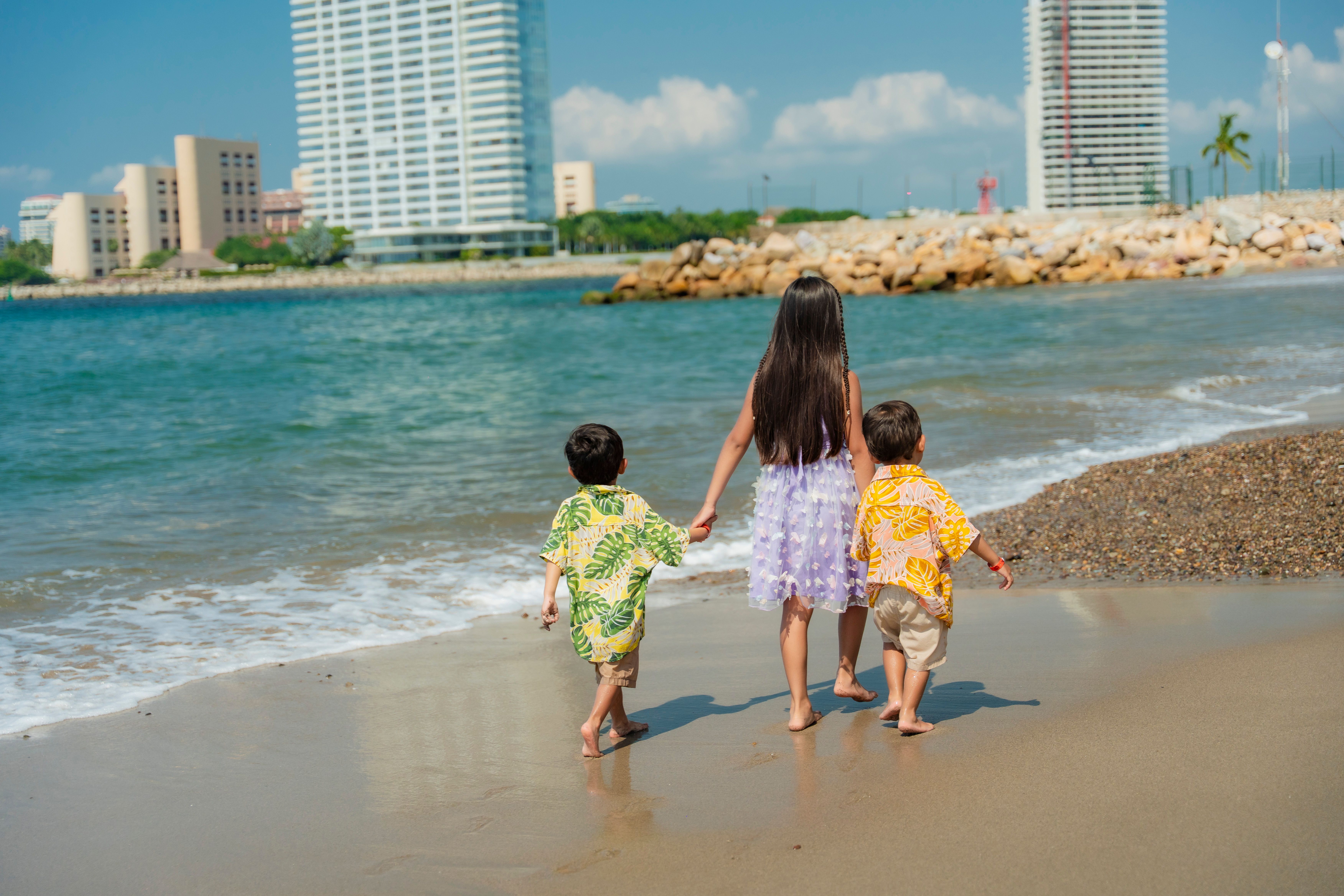 Children Enjoying a Sunny Day at the Beach · Free Stock Photo