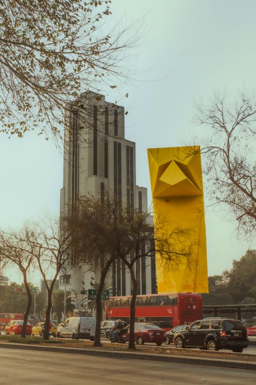 Free Explore the unique architecture and vibrant street life of Mexico City in this captivating scene. Stock Photo