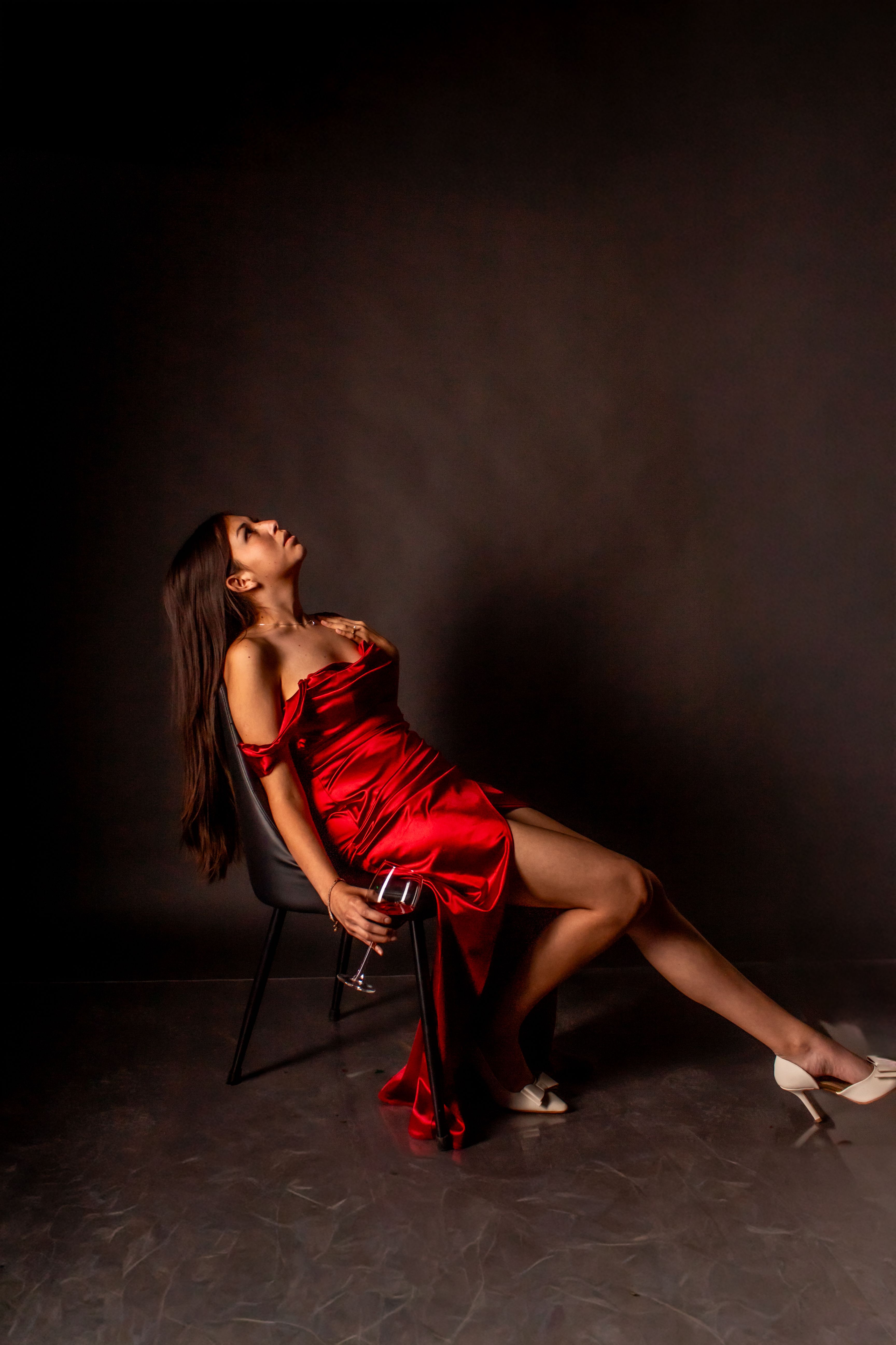 cool woman in a red dress Elegant Woman in Red Dress Relaxing Indoors · Free Stock Photo