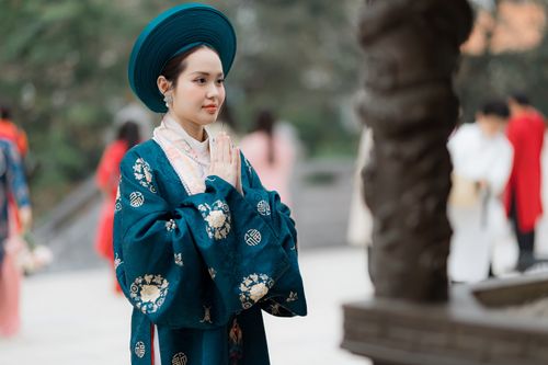 Free Woman wearing traditional Asian clothing at a cultural event outdoors. Stock Photo