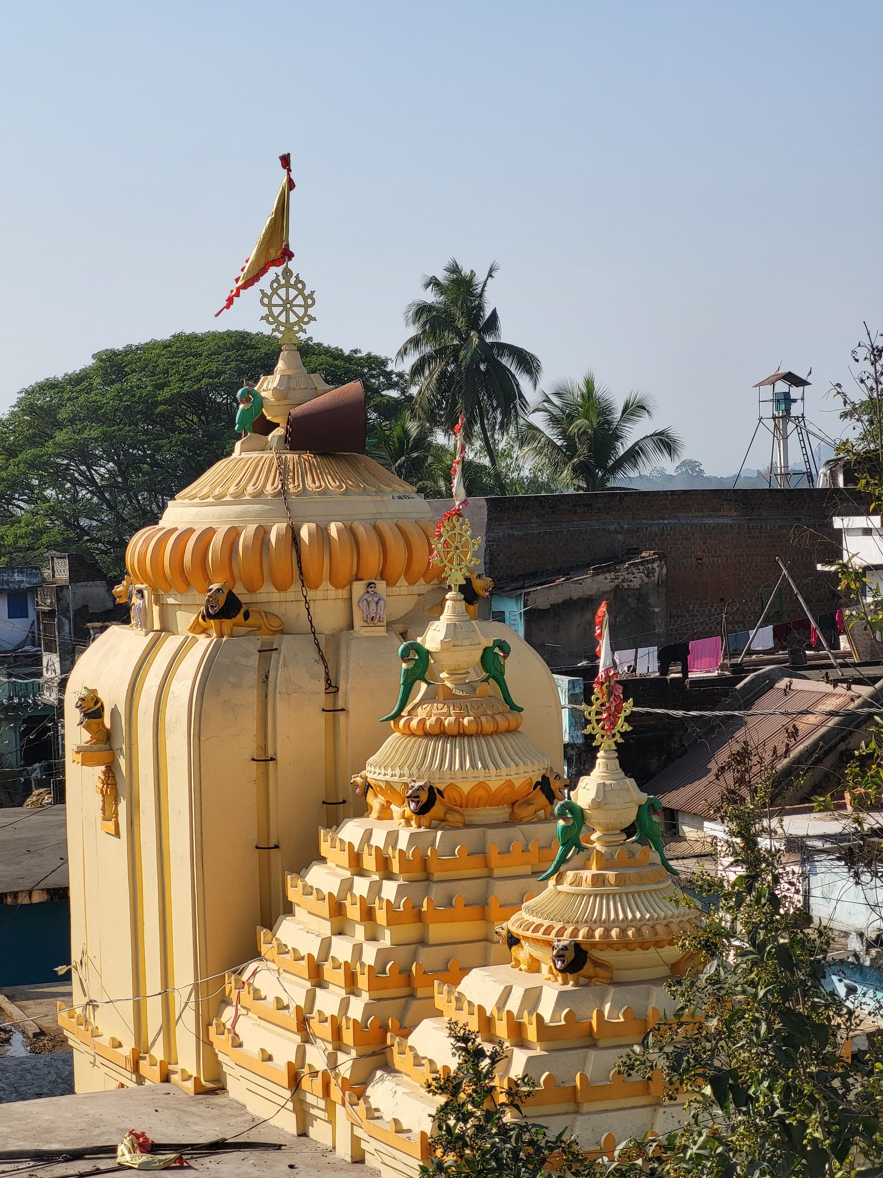 Ornate Yellow Temple with Tropical Backdrop · Free Stock Photo