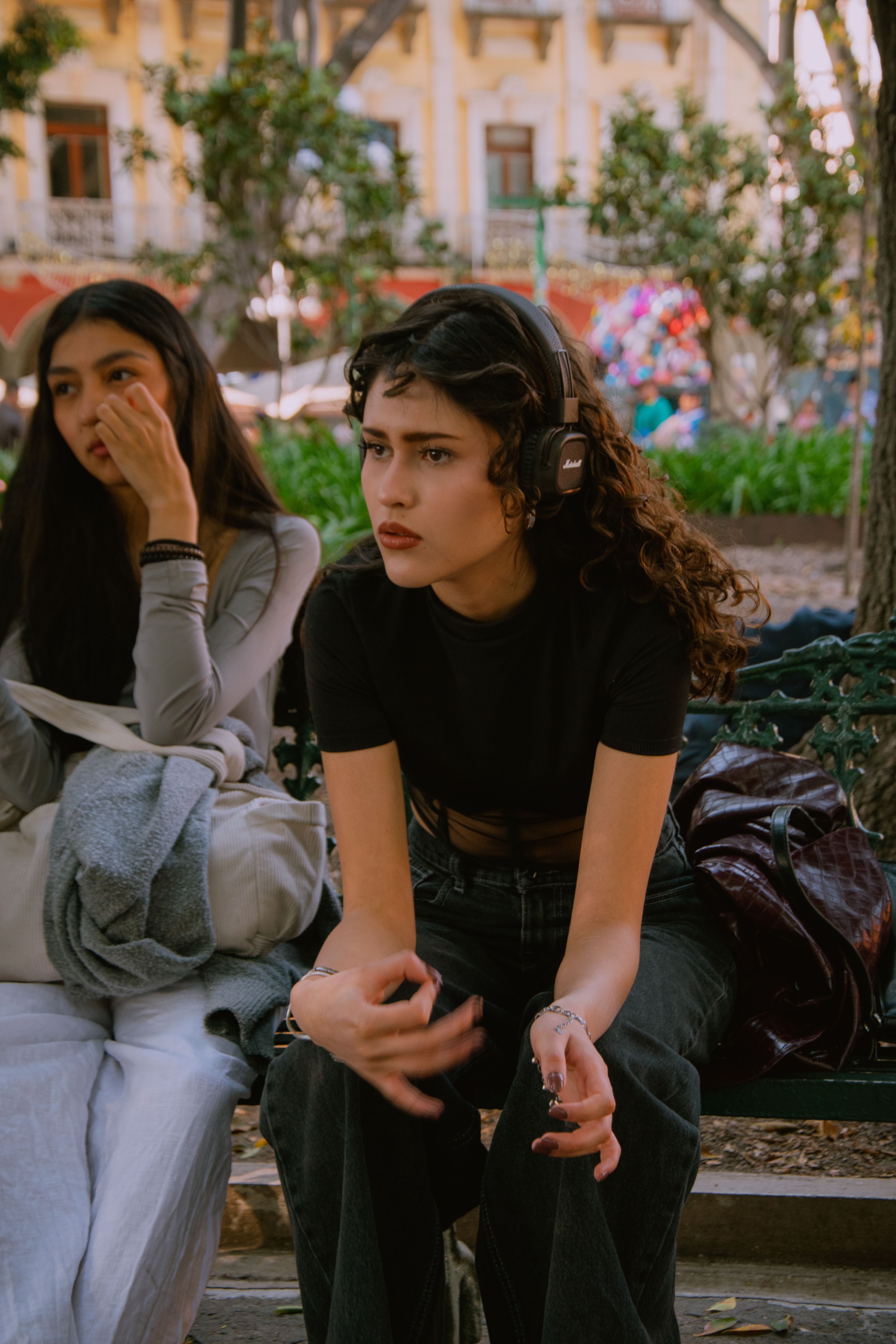 Young Women Relaxing Outdoors in Urban Park · Free Stock Photo