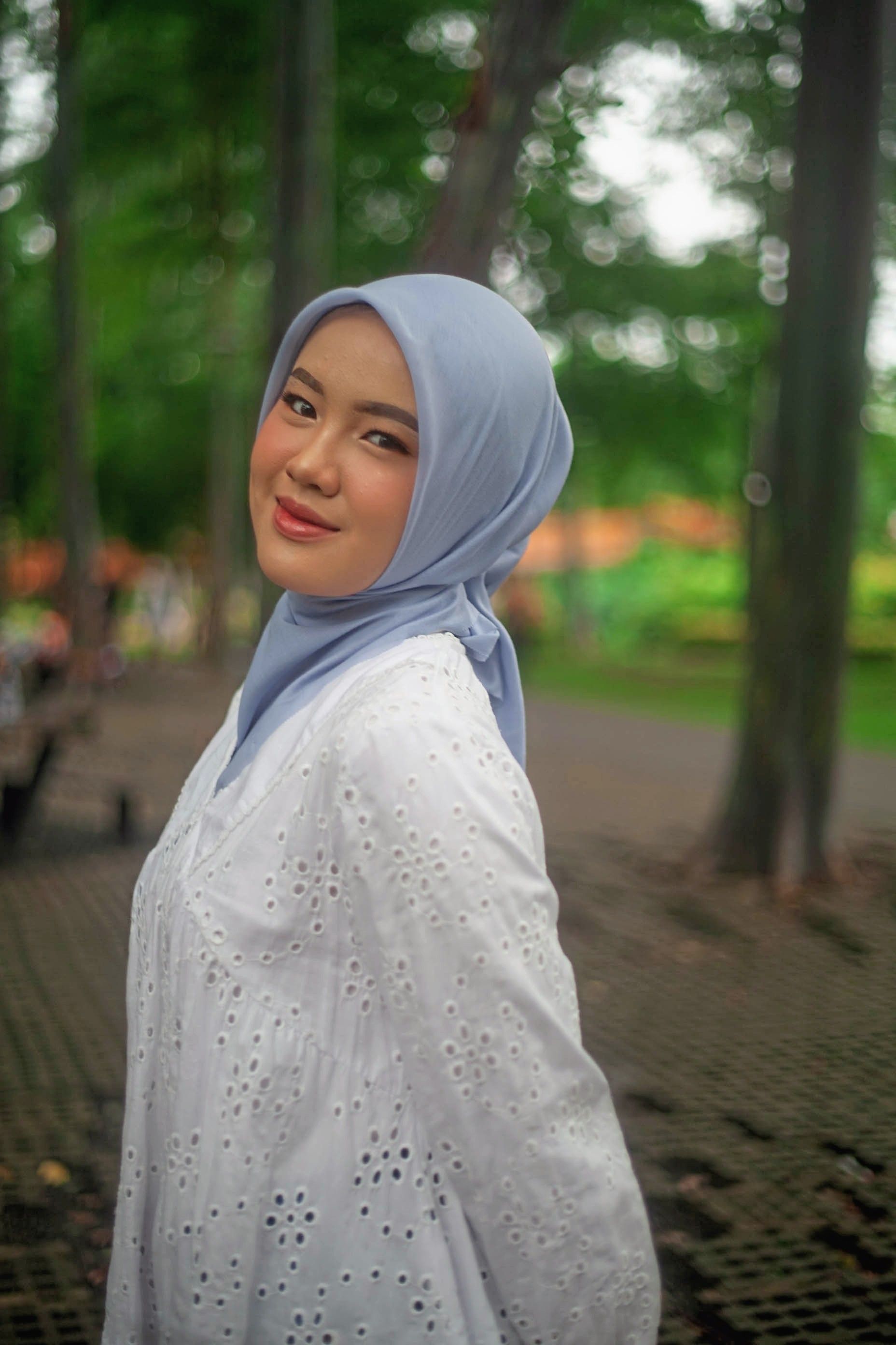 Elegant Woman in Hijab Smiling Outdoors · Free Stock Photo