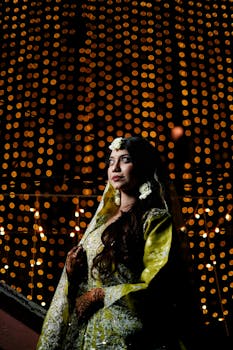 South Asian Bride Portrait with Golden Bokeh Lights at Night