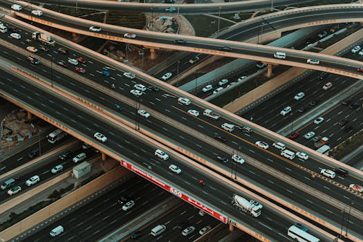 High-angle shot of a busy highway interchange in Dubai, capturing the complexity of urban traffic.