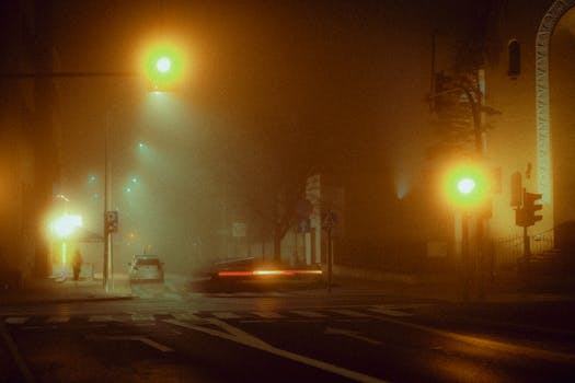 A foggy street illuminated by streetlights in Częstochowa, Poland, with a retro and moody vibe.