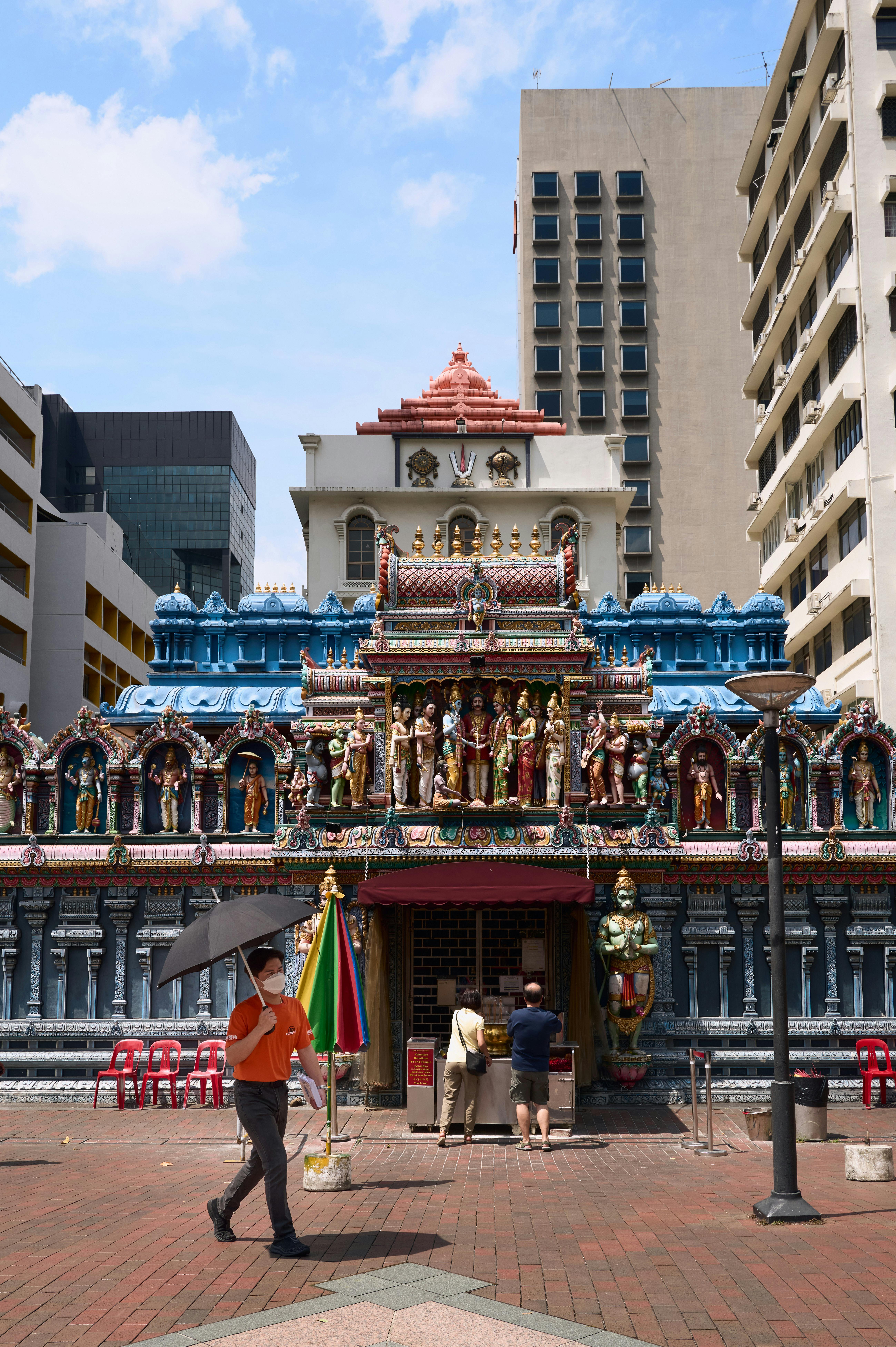 Colourful shophouses and the ornate gopuram of Sri Veeramakaliamman Temple along Serangoon Road in Little India Singapore