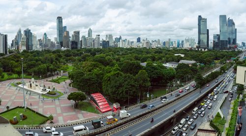 Free Stunning aerial view of Bangkok's skyline and Lumphini Park showcasing urban life and green space. Stock Photo