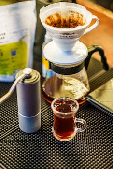 A warm setting with a pour-over coffee setup, showcasing rich coffee culture and artisanal brewing.