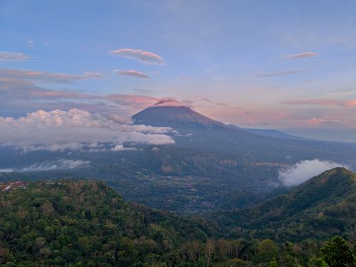 Free A breathtaking sunrise view of Mount Agung with scenic clouds from Bali, Indonesia. Stock Photo