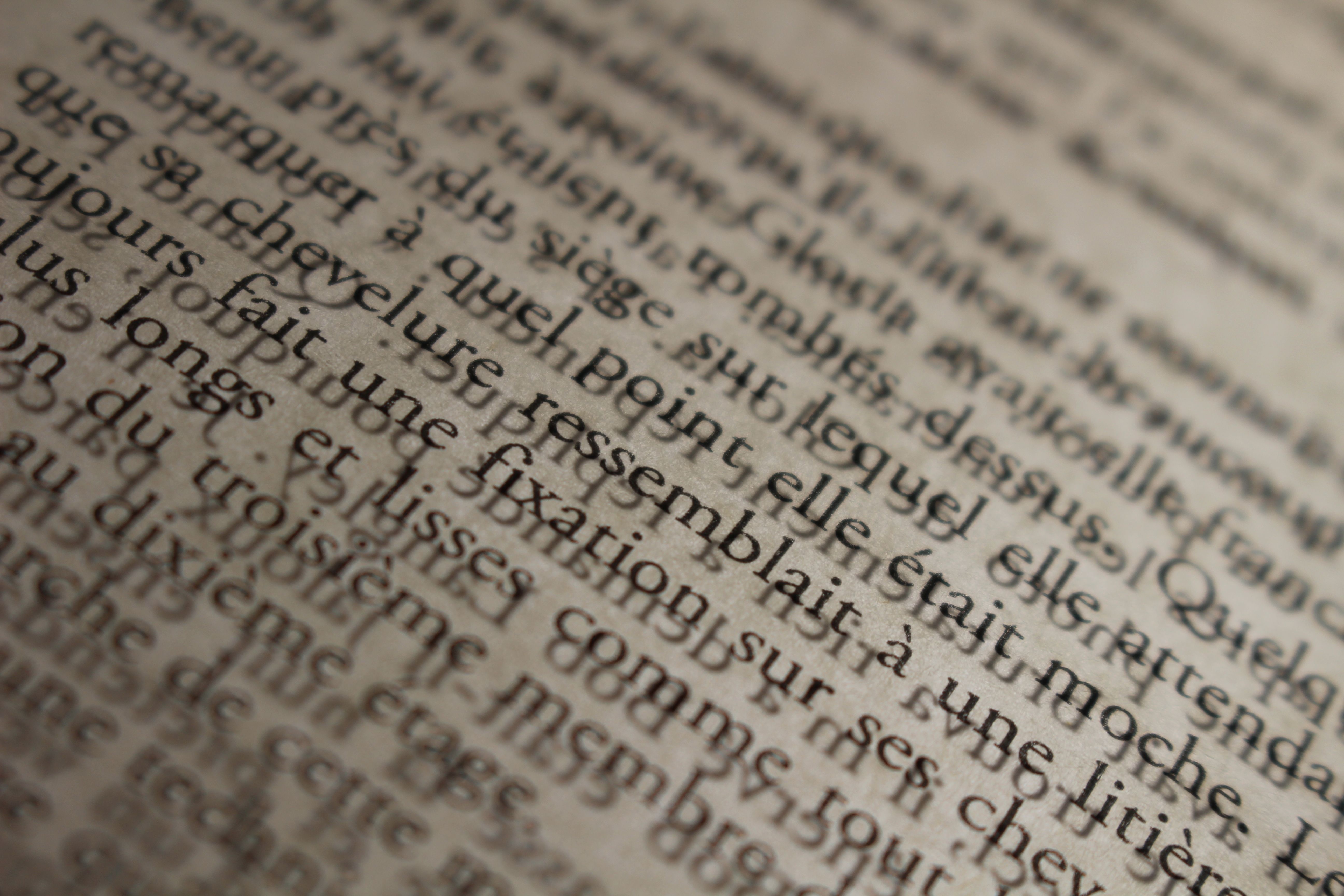 Close-up of French Text on a Vintage Page · Free Stock Photo