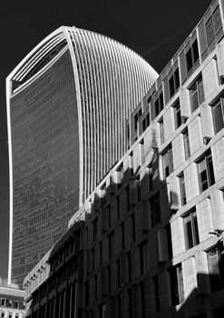 Striking black and white image of the Walkie Talkie building in London's urban landscape.