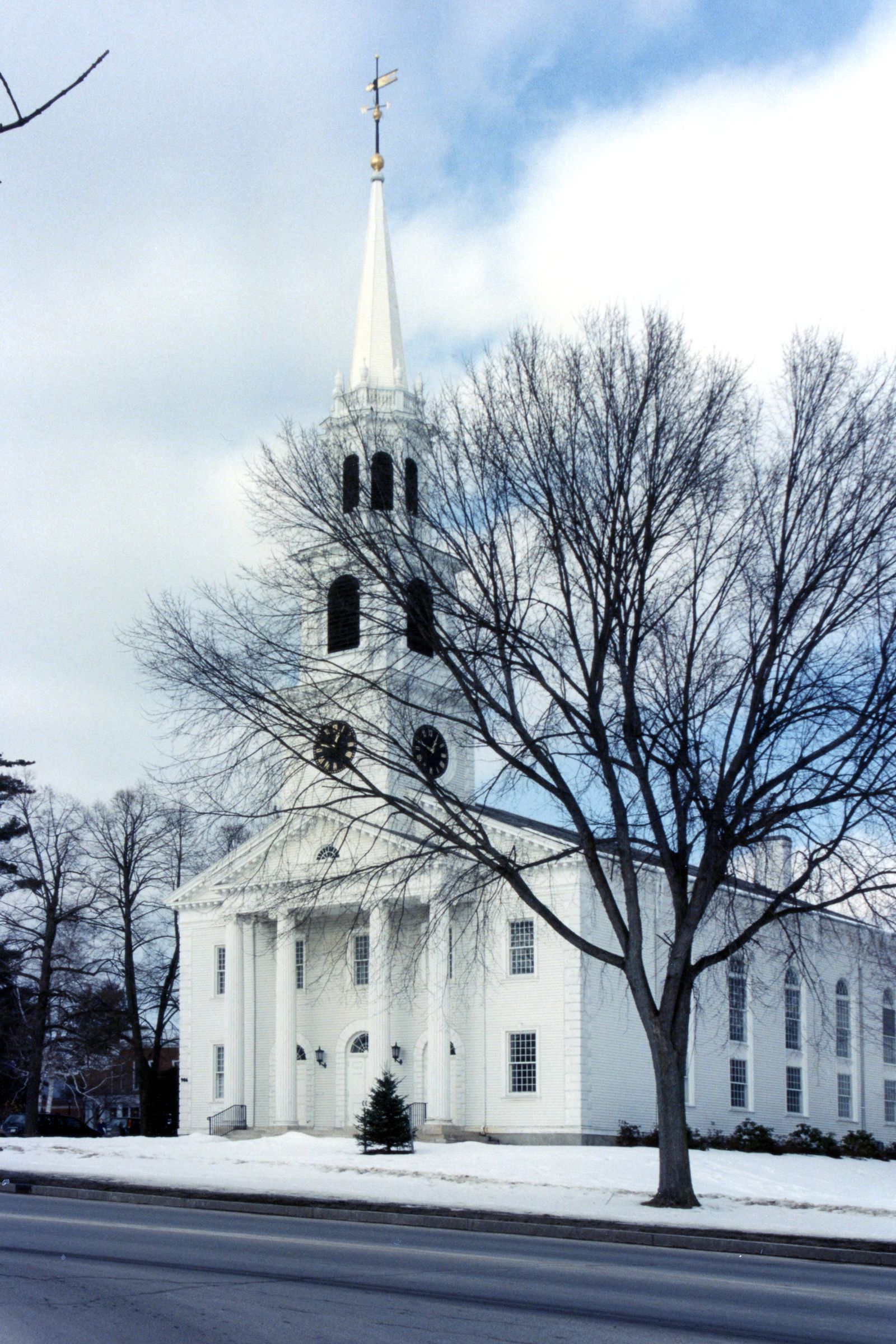 Classic white New England church in a Vermont winter landscape
