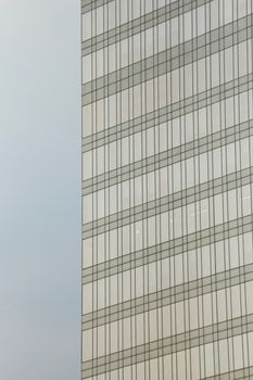 Minimalistic view of a high-rise building's glass facade in Ho Chi Minh City, Vietnam.