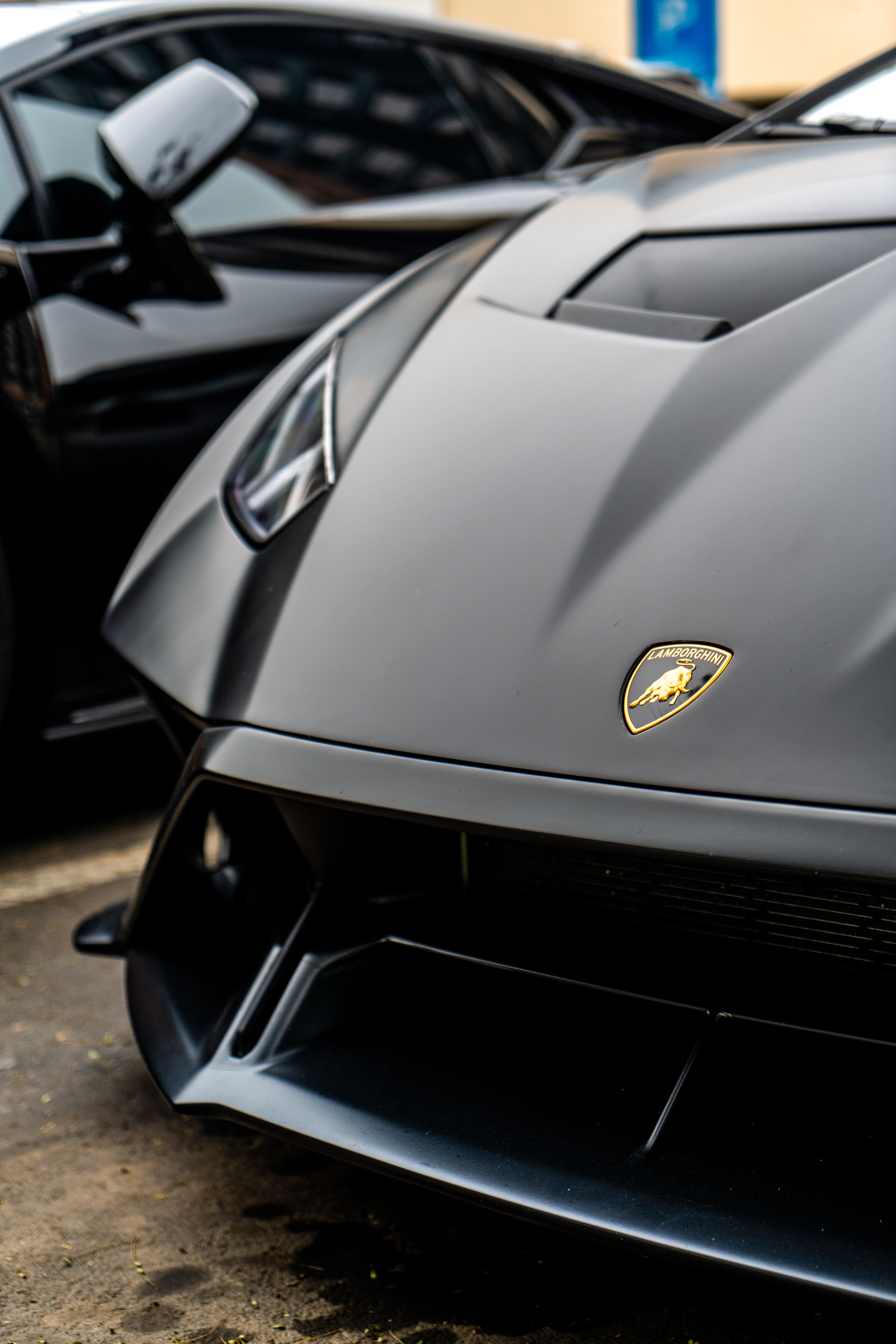 Close-up of a black Lamborghini sports car showcasing its sleek design and luxury appeal.