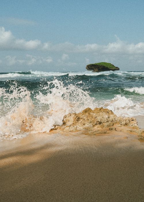 Free Capture of powerful waves hitting the rocky shore of East Java, Indonesia. Stock Photo