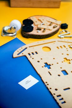 Close-up of DIY robotics kit parts on vibrant background, showcasing innovation and technology.