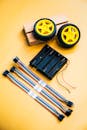 Yellow Robotics Kit Components on Yellow Background